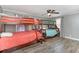 Bedroom with wooden bunk beds, hardwood flooring, ceiling fan, and natural light from the window at 6001-Mh409 S Kings Hwy., Myrtle Beach, SC 29575