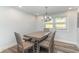 Cozy dining room features modern lighting and a dining table with seating for four at 6001-Mh409 S Kings Hwy., Myrtle Beach, SC 29575