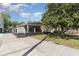 Charming home with a spacious driveway and large, mature trees for shade and curb appeal at 6001-Mh409 S Kings Hwy., Myrtle Beach, SC 29575