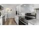 Kitchen with laundry closet equipped with stainless steel appliances and granite countertops at 6001-Mh409 S Kings Hwy., Myrtle Beach, SC 29575