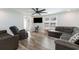 Relaxing living room with hardwood floors, flat-screen TV, comfortable seating, and natural light from the window at 6001-Mh409 S Kings Hwy., Myrtle Beach, SC 29575