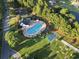 An aerial view of the community pool area including pool, tennis court, playground, and picnic area at 736 Lalton Dr., Conway, SC 29526