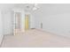 Upstairs bedroom with bright yellow adjoining room and doorway to full bath at 736 Lalton Dr., Conway, SC 29526