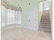 Bright dining room boasting natural light, a staircase, and tile flooring for easy maintenance and elegance at 736 Lalton Dr., Conway, SC 29526