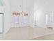 Bright dining room with tile floor, chandelier, and ample space for entertaining at 736 Lalton Dr., Conway, SC 29526