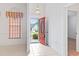 Inviting foyer with tile flooring, chandelier, and striking red front door at 736 Lalton Dr., Conway, SC 29526