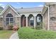 A well-maintained property with a brick facade, complemented by manicured greenery and inviting front entrance at 736 Lalton Dr., Conway, SC 29526