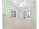 Light-filled living room featuring tile floors, and a ceiling fan, creating a seamless flow with the outdoors at 736 Lalton Dr., Conway, SC 29526