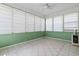 Cozy sunroom featuring bright windows, tiled floors, and versatile space for a relaxing retreat or entertainment at 736 Lalton Dr., Conway, SC 29526