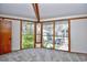 Bedroom with large windows offering outdoor views and a modern feel with neutral carpet and wood trim at 742 Tall Oaks Ct., Myrtle Beach, SC 29588
