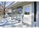 Deck with entrance door and full wall of windows providing bright natural light at 742 Tall Oaks Ct., Myrtle Beach, SC 29588