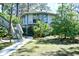Charming two-story home with lush landscaping and a welcoming walkway at 742 Tall Oaks Ct., Myrtle Beach, SC 29588