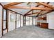 Open concept living room showing kitchen with vaulted ceilings and plenty of natural light at 742 Tall Oaks Ct., Myrtle Beach, SC 29588