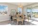 Cozy dining area features stylish chandelier, table and chairs, and natural light at 745 Choctaw Dr., Conway, SC 29526