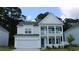 Charming two-story home with a welcoming porch and a well-manicured lawn, showcasing curb appeal at 745 Choctaw Dr., Conway, SC 29526