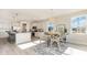Bright kitchen features stainless steel appliances, a granite island, and a breakfast nook with a stylish chandelier at 745 Choctaw Dr., Conway, SC 29526