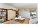 Cozy living room featuring a large sliding barn door built-in shelving unit and a modern coffee table at 745 Choctaw Dr., Conway, SC 29526