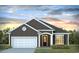 Charming single-story home with gray siding, white trim, a two-car garage, and professionally landscaped front yard at 777 Choctaw Dr., Conway, SC 29526