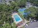 Aerial shot of pool, tennis courts, and trees in a quiet residential neighborhood at 830 44Th Ave. N # B4, Myrtle Beach, SC 29577