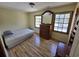 Cozy bedroom featuring hardwood floors, natural light, and classic furnishings at 830 44Th Ave. N # B4, Myrtle Beach, SC 29577
