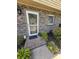 Inviting front entry featuring a glass storm door, brick walkway, and decorative shutters at 830 44Th Ave. N # B4, Myrtle Beach, SC 29577