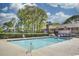 Large community pool with lounge chairs, tables, and fencing at 830 44Th Ave. N # B4, Myrtle Beach, SC 29577