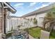 Cozy backyard with white privacy fence and a patio set perfect for outdoor dining at 830 Howard Ave. # D, Myrtle Beach, SC 29577
