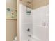 Clean bathroom showcasing a shower-tub combination with wall-mounted accessories at 830 Howard Ave. # D, Myrtle Beach, SC 29577