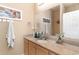 Well-lit bathroom featuring a granite countertop and a wall-mounted towel rack at 830 Howard Ave. # D, Myrtle Beach, SC 29577