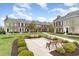 Beautiful courtyard showcasing manicured lawns, park benches and lush landscaping at 830 Howard Ave. # D, Myrtle Beach, SC 29577