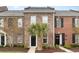 Charming red brick townhomes with manicured lawns and beautiful palm trees for curb appeal at 830 Howard Ave. # D, Myrtle Beach, SC 29577