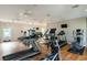 Spacious gym with treadmills, elliptical machines, weights, and mounted televisions at 830 Howard Ave. # D, Myrtle Beach, SC 29577