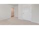 Bright bedroom showcasing neutral carpet, white trim, and a large closet door at 843 Buttonwood Dr., Conway, SC 29527