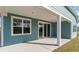 Covered back patio featuring sliding glass doors and white columns perfect for relaxing outdoors at 872 Ireland Dr., Longs, SC 29568