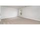 Bright bedroom with neutral carpet, light walls, and a window offering pleasant views at 877 Ireland Dr., Longs, SC 29568