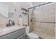 Updated bathroom with granite vanity top and a tiled shower featuring a glass door at 929 Tidewater Dr., North Myrtle Beach, SC 29582