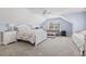 Spacious bedroom with light blue walls, white trim, carpet, and large bed at 929 Tidewater Dr., North Myrtle Beach, SC 29582
