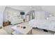 Bright bedroom with a sofa, ceiling fan and two beds beneath a vaulted ceiling at 929 Tidewater Dr., North Myrtle Beach, SC 29582