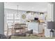 Dining area with white table and chairs and a view into the kitchen at 929 Tidewater Dr., North Myrtle Beach, SC 29582