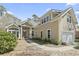 Charming home with lush landscaping, a two-car garage, and inviting front porch at 929 Tidewater Dr., North Myrtle Beach, SC 29582
