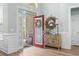 Inviting foyer with hardwood floors and a decorative mirror and console table at 929 Tidewater Dr., North Myrtle Beach, SC 29582