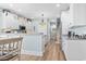 Open kitchen boasts white cabinets, modern appliances, and a spacious breakfast bar at 929 Tidewater Dr., North Myrtle Beach, SC 29582