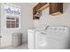 Bright laundry room features tile flooring and appliances ready for use at 929 Tidewater Dr., North Myrtle Beach, SC 29582