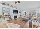 Spacious living room featuring a fireplace, large sectional, and ample natural light at 929 Tidewater Dr., North Myrtle Beach, SC 29582