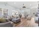 Large living room with plenty of seating, wood floors, and an open concept floor plan at 929 Tidewater Dr., North Myrtle Beach, SC 29582