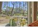Relaxing backyard patio overlooking a scenic, wooded landscape at 929 Tidewater Dr., North Myrtle Beach, SC 29582