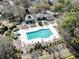 Aerial view of a community pool with ample seating and green landscaping at 929 Tidewater Dr., North Myrtle Beach, SC 29582