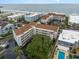 Aerial view of oceanfront condos with a pool, parking and landscaped grounds near the beach at 9581 Shore Dr. # 223, Myrtle Beach, SC 29572