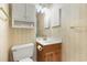 Functional bathroom featuring a vanity, mirror, and toilet at 9581 Shore Dr. # 223, Myrtle Beach, SC 29572