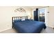 Bedroom with balcony access, neutral walls, and comfortable decor at 9581 Shore Dr. # 223, Myrtle Beach, SC 29572